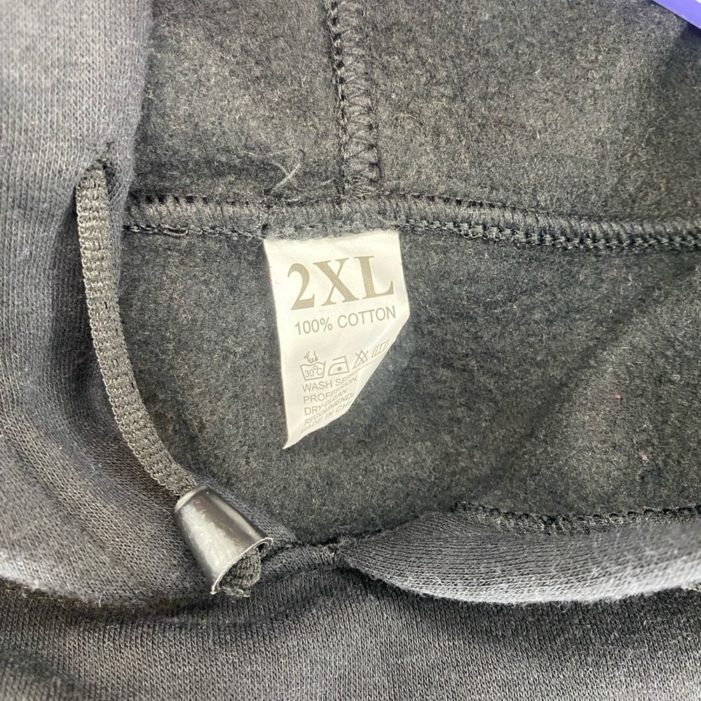 Black Hoodie with Graphic Design and Nostalgic Appeal - Picture 3 of 6